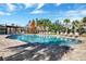 Community pool with ample lounge chairs on a brick paver deck in a beautiful area at 480 Buckhorn Dr, Winter Springs, FL 32708