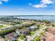 Aerial view showing a subdivision and the lake in the distance at 4940 Tennessee Lake Dr, Auburndale, FL 33823