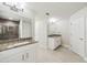 Spacious bathroom with double vanities, granite countertops, and a tiled shower at 4940 Tennessee Lake Dr, Auburndale, FL 33823