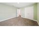 Bedroom with light green walls and large double door closet at 4940 Tennessee Lake Dr, Auburndale, FL 33823