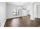 Dining room with hardwood floors, wainscoting, and a stylish chandelier at 4940 Tennessee Lake Dr, Auburndale, FL 33823