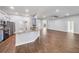 Open kitchen with island, granite countertops, stainless steel appliances, and views of the living space at 4940 Tennessee Lake Dr, Auburndale, FL 33823