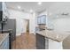 Beautiful kitchen with granite countertops, stainless steel appliances, and wood floors at 4940 Tennessee Lake Dr, Auburndale, FL 33823