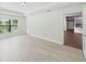 Living room with tiled floors, recessed lights, and access to the backyard at 4940 Tennessee Lake Dr, Auburndale, FL 33823