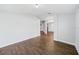 Open-concept living area with wood-look tile flooring and lots of natural light at 4940 Tennessee Lake Dr, Auburndale, FL 33823