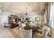 Comfortable lounge area with elegant seating, chandeliers, and access to other amenities like a game room at 4940 Tennessee Lake Dr, Auburndale, FL 33823