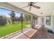 Beautiful view of the lawn, shrubs, and backyard from the tiled and screened patio at 4940 Tennessee Lake Dr, Auburndale, FL 33823