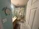 Cozy bathroom featuring tile floors, a wood vanity, and a shower-tub combo with patterned curtain at 56 Redwood Rd, Ocala, FL 34472