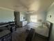 Serene main bedroom featuring a queen-sized bed, ceiling fan, and wood-look flooring at 56 Redwood Rd, Ocala, FL 34472