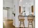 Bright breakfast bar area offers seamless transition into the main kitchen area with views to the living room at 561 Vineyard Way, Poinciana, FL 34759