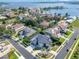 Aerial view of houses in a lakeside residential area with mature landscaping and lake views at 5708 Emerington Cres, Orlando, FL 32819
