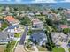 Aerial view of houses in a lakeside residential area with mature landscaping, and beautiful lake views at 5708 Emerington Cres, Orlando, FL 32819