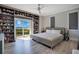 This spacious bedroom features custom storage and a walkout to a balcony with a view at 5708 Emerington Cres, Orlando, FL 32819