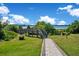 A wooden walkway leads to the boat dock overlooking the lake in a serene, natural setting at 5708 Emerington Cres, Orlando, FL 32819