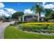 A lush entrance to Emerson Pointe with manicured flower beds and a decorative stone sign at 5708 Emerington Cres, Orlando, FL 32819