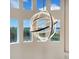 Unique light fixture and clerestory windows adding architectural detail and natural light to the foyer at 5708 Emerington Cres, Orlando, FL 32819