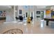Expansive foyer with spiral staircase, high ceilings, unique artwork, and an elegant pool table at 5708 Emerington Cres, Orlando, FL 32819