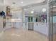 Bright kitchen with modern white cabinetry, stainless steel appliances, and marble countertops at 5708 Emerington Cres, Orlando, FL 32819