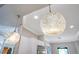 A close up of the modern pendant lighting above the kitchen breakfast bar at 5708 Emerington Cres, Orlando, FL 32819