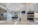 Bright, modern kitchen with stainless steel appliances, an eat-in dining area, and sleek cabinetry at 5708 Emerington Cres, Orlando, FL 32819