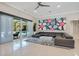 Bright living room with tile floors, large sectional sofa, and sliding glass doors to the pool area at 5708 Emerington Cres, Orlando, FL 32819