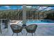 Relaxing screened pool area with tiled patio and comfortable lounge furniture at 5708 Emerington Cres, Orlando, FL 32819