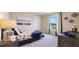 Inviting bedroom with nautical theme, natural light, and decorative accents at 7206 Nottingham Reel Ct, St Cloud, FL 34773