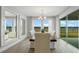 Bright dining room with multiple windows and a sliding glass door to the patio at 7206 Nottingham Reel Ct, St Cloud, FL 34773