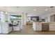 Open-concept dining and kitchen area with an island and stainless steel dishwasher at 7206 Nottingham Reel Ct, St Cloud, FL 34773