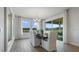 Bright dining room with large windows and sliding glass door to an outdoor area at 7206 Nottingham Reel Ct, St Cloud, FL 34773