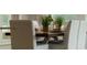 Close up on a dining table with seating for six and decorative centerpieces at 7206 Nottingham Reel Ct, St Cloud, FL 34773