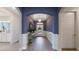Bright and inviting entryway with stylish decor and a view of the front door at 7206 Nottingham Reel Ct, St Cloud, FL 34773