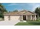 Charming single-story home with a three-car garage and a well-manicured lawn at 7206 Nottingham Reel Ct, St Cloud, FL 34773