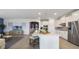 Modern kitchen with stainless steel appliances and a spacious island with seating at 7206 Nottingham Reel Ct, St Cloud, FL 34773
