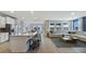 Open-concept living room with a modern kitchen and plenty of natural light at 7206 Nottingham Reel Ct, St Cloud, FL 34773