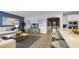 Open concept living area with a kitchen island, perfect for entertaining guests at 7206 Nottingham Reel Ct, St Cloud, FL 34773