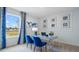 Home office space with blue accents, a desk, artwork, and a window providing natural light at 7206 Nottingham Reel Ct, St Cloud, FL 34773
