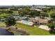 Aerial view showcases community amenities including a pool, tennis courts, playground, and sand volleyball court at 7237 Woodville Cres, Orlando, FL 32819