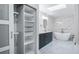 Beautiful bathroom featuring a free standing tub, marble accents, and large vanity at 7237 Woodville Cres, Orlando, FL 32819