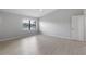 Bedroom with a large window providing a view of the lake at 7237 Woodville Cres, Orlando, FL 32819