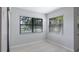 Cozy bedroom features hardwood floors and serene outdoor view at 7237 Woodville Cres, Orlando, FL 32819