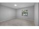 Neutral bedroom with wood floors and natural light through window at 7237 Woodville Cres, Orlando, FL 32819