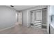 Cozy bedroom with wood floors, natural light, and a large built-in closet at 7237 Woodville Cres, Orlando, FL 32819