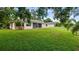 Exterior shot showing the backyard and screened lanai at 7237 Woodville Cres, Orlando, FL 32819