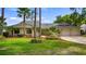 Beautiful single Gathering home with a three-car garage, mature landscaping, and a well-maintained lawn at 7237 Woodville Cres, Orlando, FL 32819