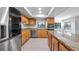 Large kitchen with granite counters, stainless appliances, and ample cabinet space at 7237 Woodville Cres, Orlando, FL 32819