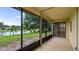 Relaxing screened lanai with a view of the lake and backyard at 7237 Woodville Cres, Orlando, FL 32819
