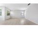 Spacious living room with light hardwood floors and ample natural light at 7237 Woodville Cres, Orlando, FL 32819