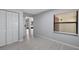 Bright living room with hardwood floors, natural light, and convenient closet space at 7237 Woodville Cres, Orlando, FL 32819