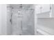 Modern bathroom with glass shower, marble tile, and convenient built-in shower niche at 7237 Woodville Cres, Orlando, FL 32819